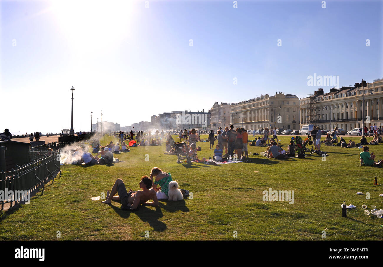 Crowds enjoying barbecues on Hove Lawns on a hot summers day Brighton UK Stock Photo