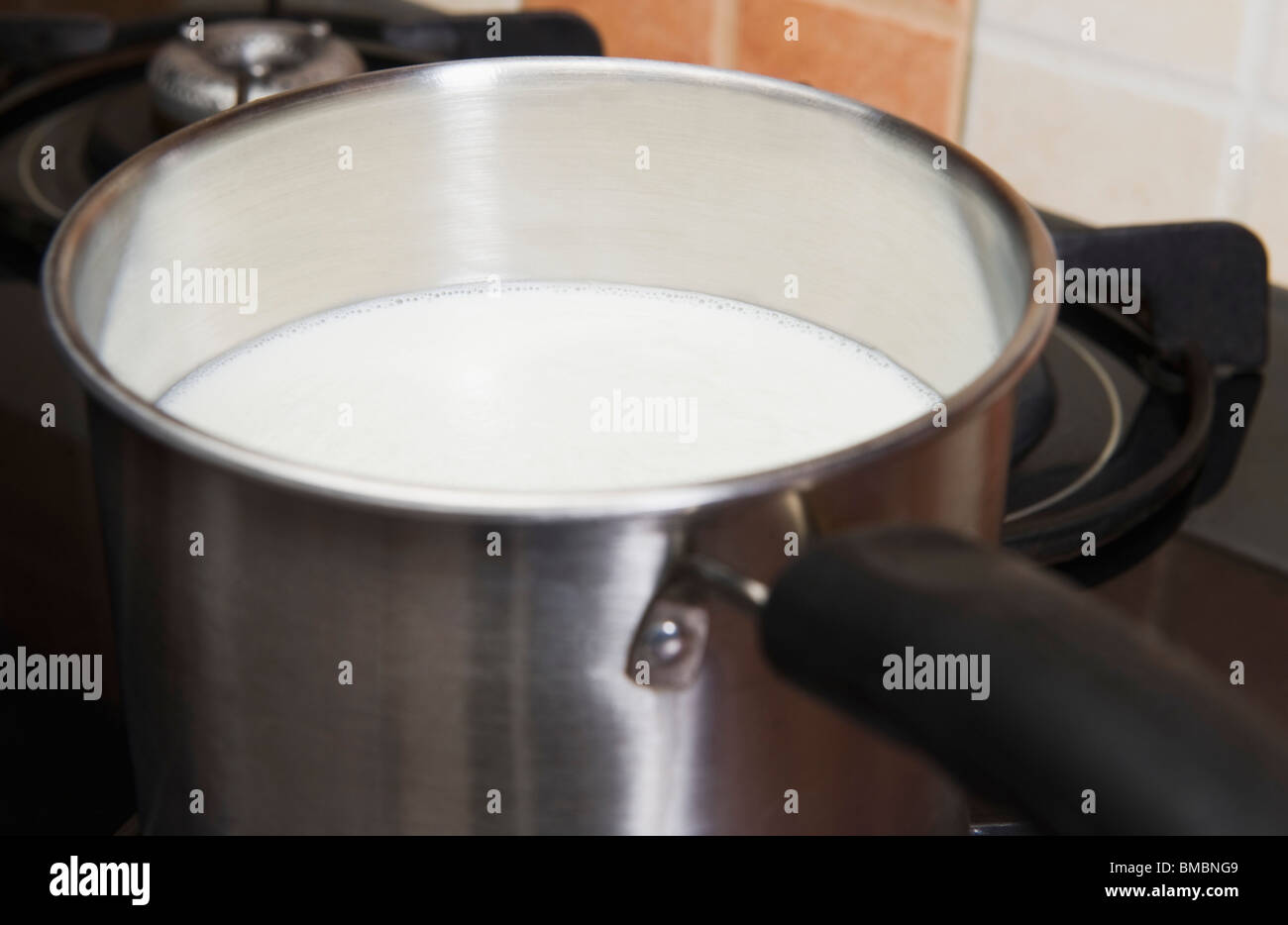 Cooking milk on a stove hires stock photography and images Alamy