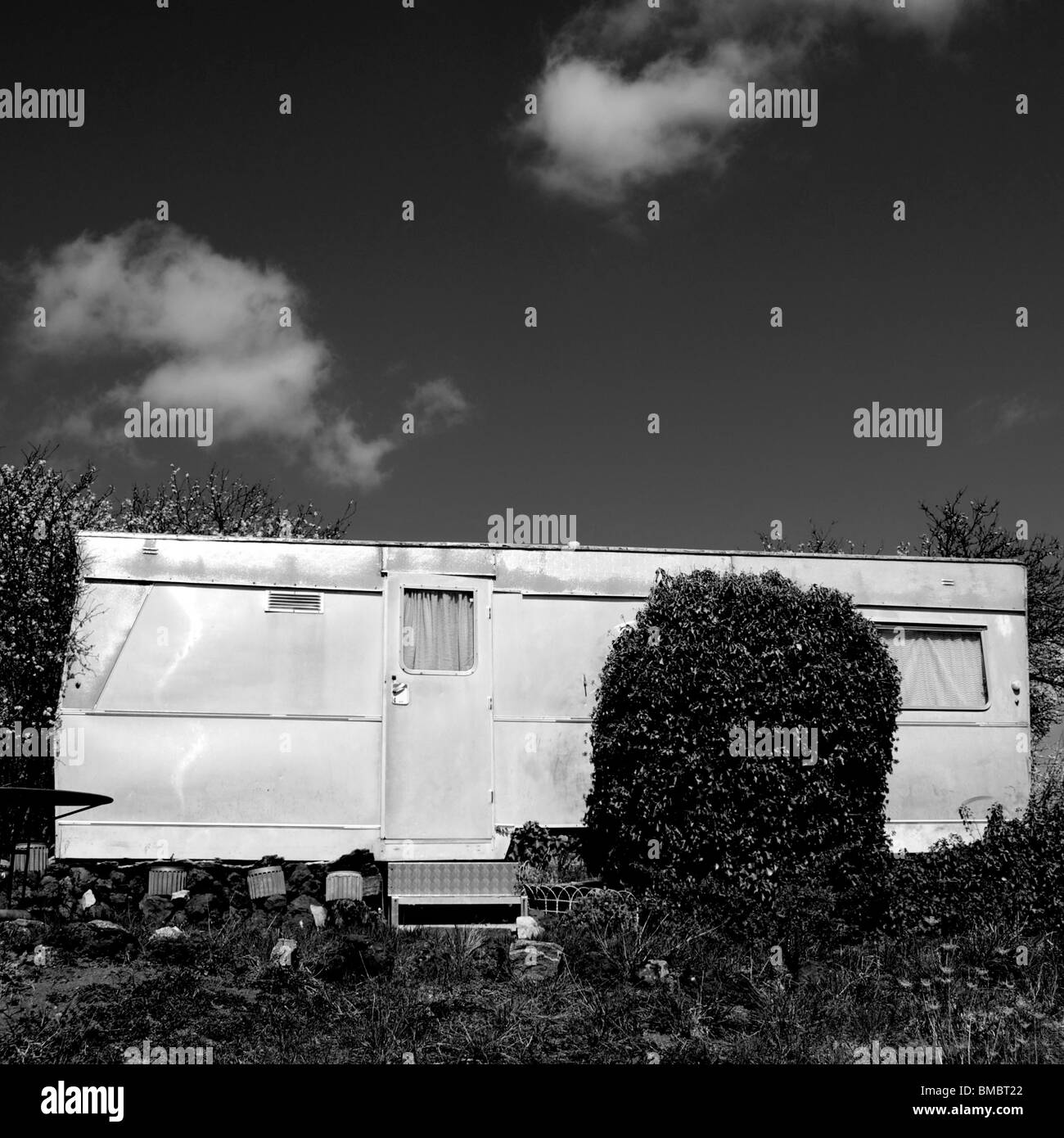 Old trailer isolated in the countryside. Stock Photo