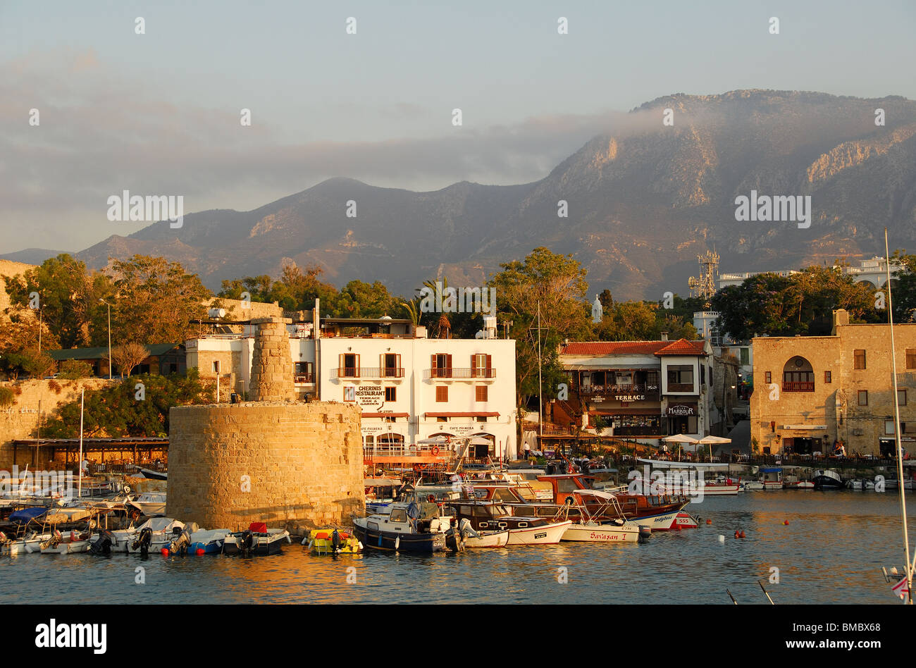 KYRENIA, NORTH CYPRUS. An evening view of the harbour and town, with the Kyrenia mountain range behind. 2009. Stock Photo