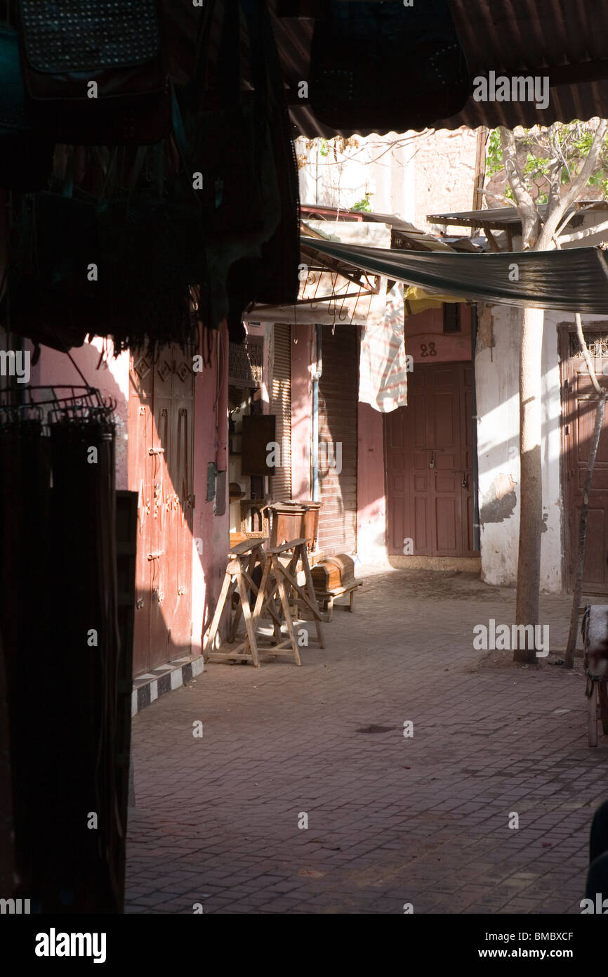 Sun shining down into quiet street in the medina , Marrakesh , Morocco , North Africa Stock Photo