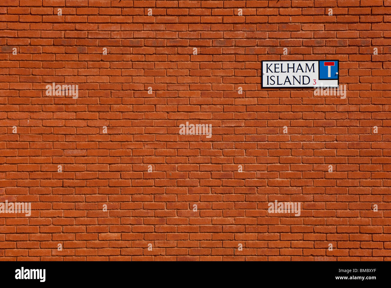 Street sign on a red brick wall in Kelham Island, Sheffield. Stock Photo