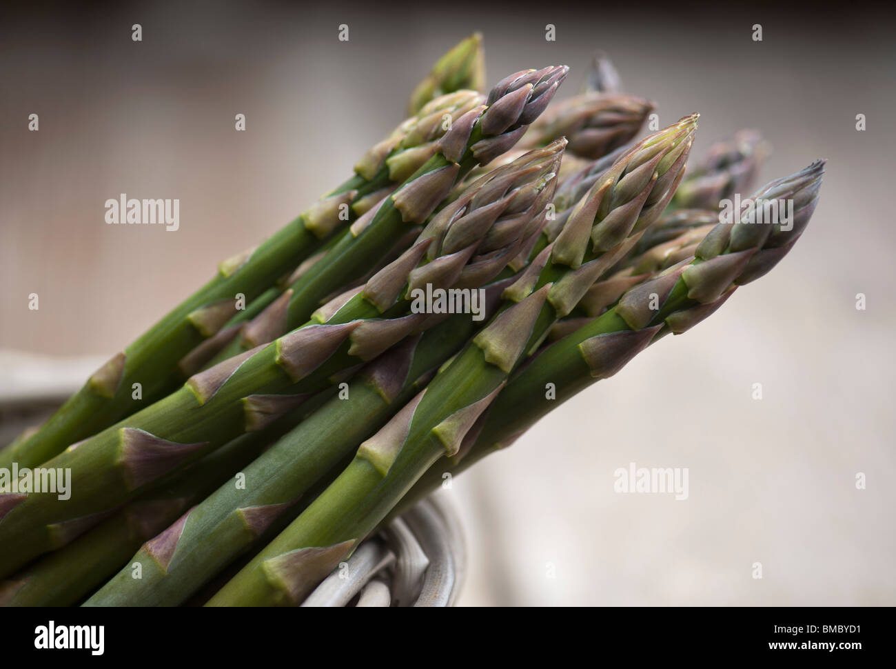 A Bunch Of Fresh Asparagus In A Basket Stock Photo