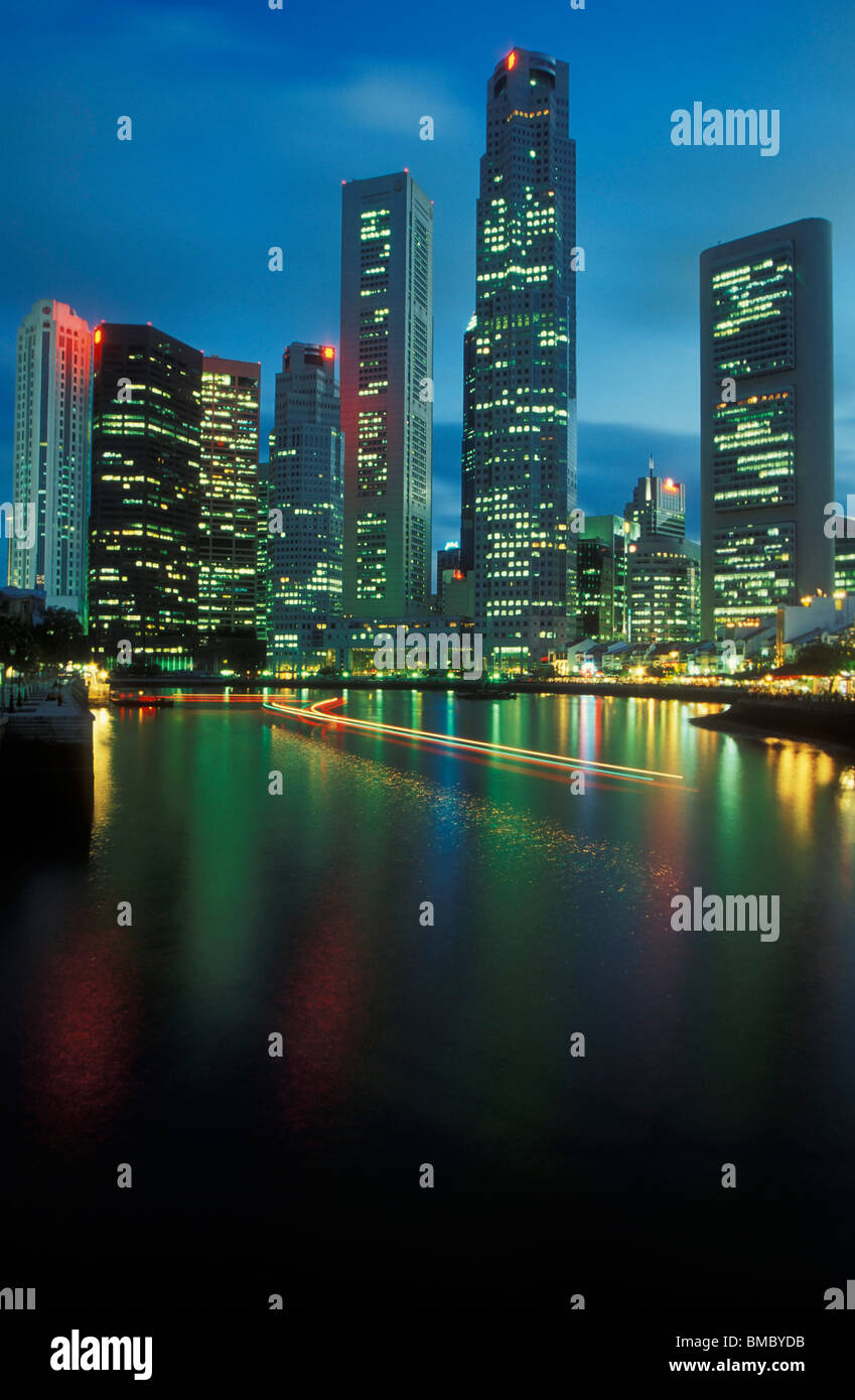 Light trails from passing excursion boat Boat Quay Singapore Stock