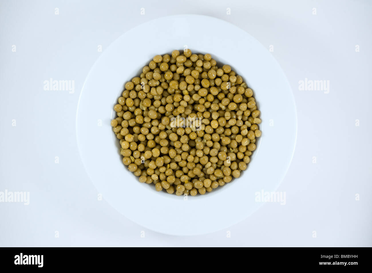 Peas in white soup bowl studio image Stock Photo