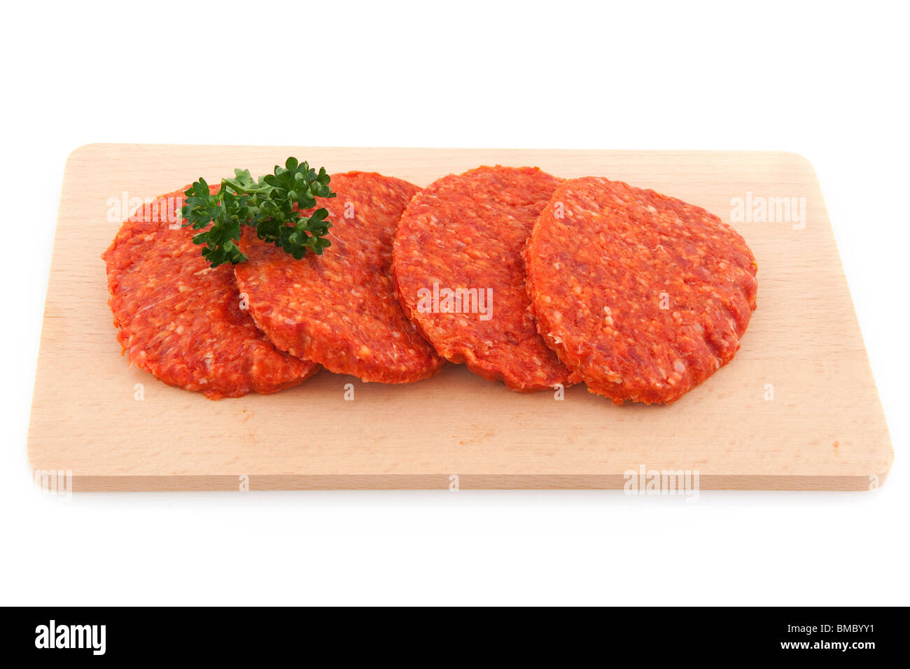 Raw hamburgers with parsley isolated over white Stock Photo