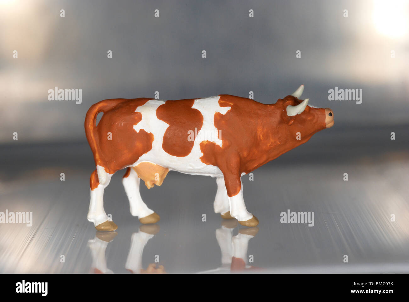 Plastic model cow. Stock Photo