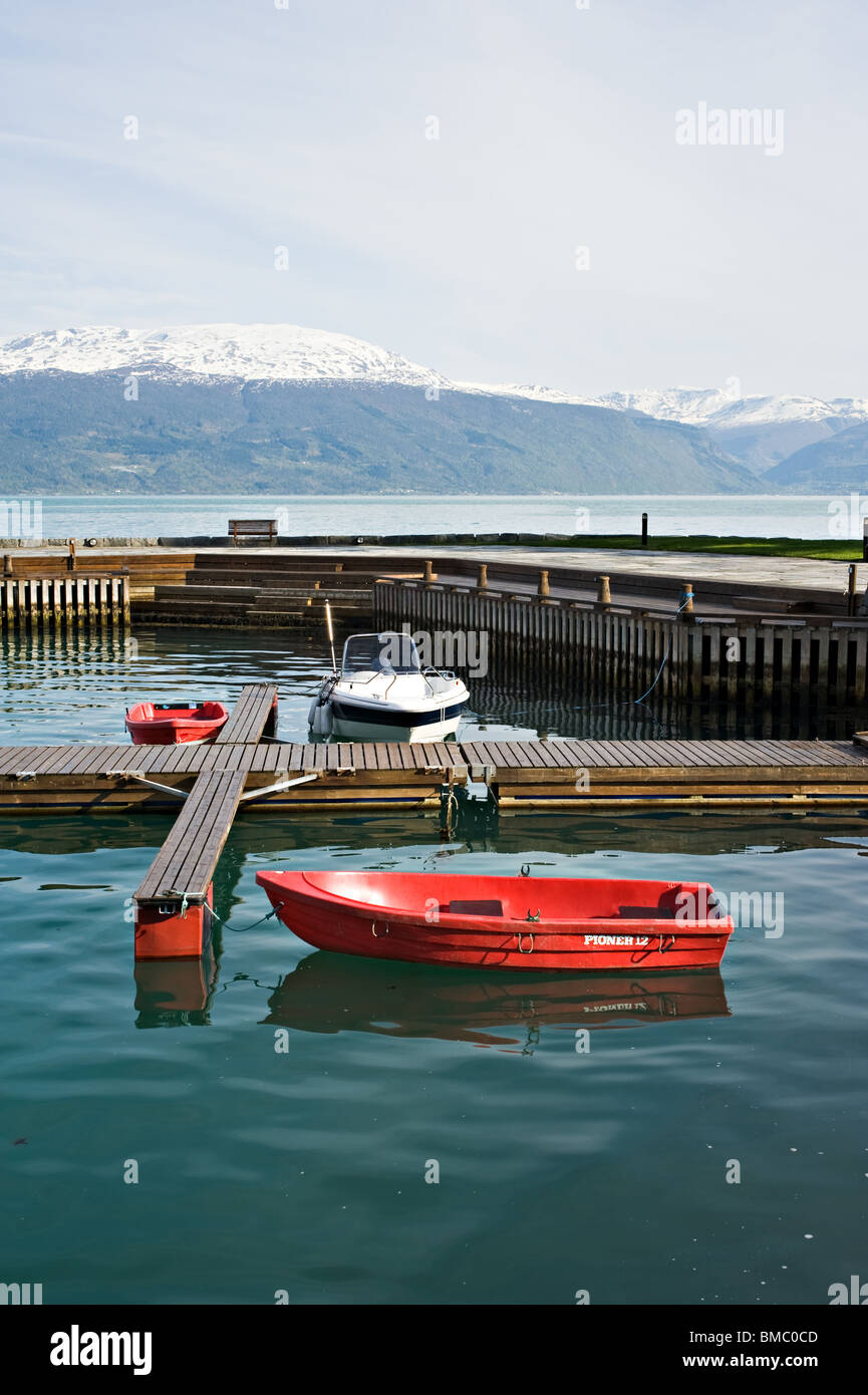 Small Harbour in Sognefjord in Balestrand near Kviknes Hotel Sogn Norway with re and white boats Stock Photo