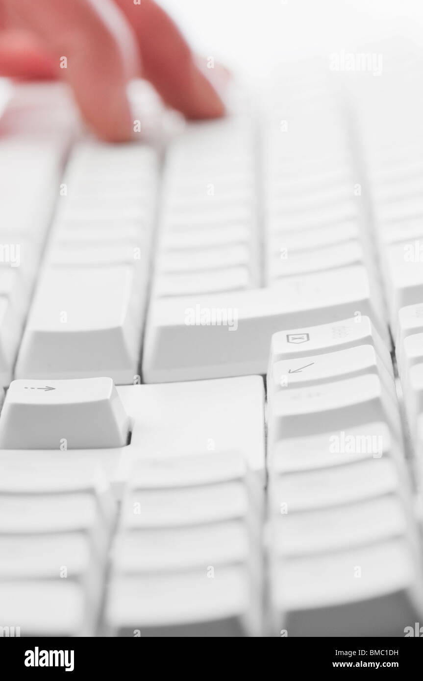 Worker typing on computer keyboard entering data Stock Photo - Alamy