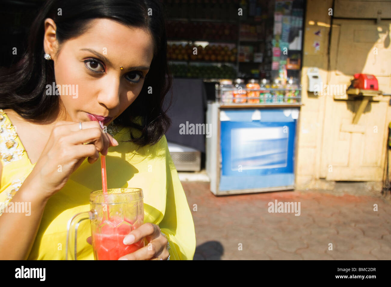 Woman drinking juice, Mumbai, Maharashtra, India Stock Photo Alamy