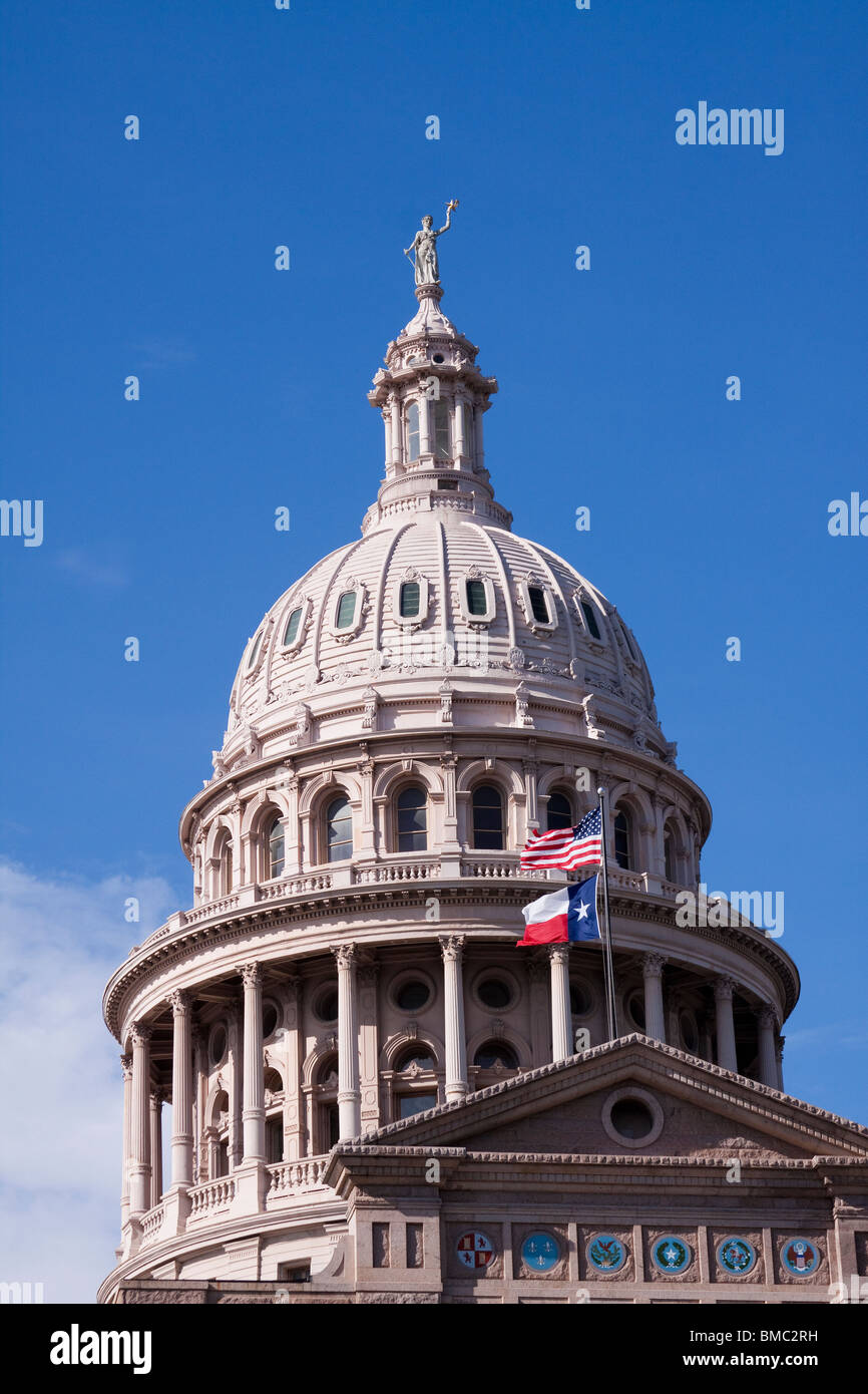 Dome of Texas state capitol building or statehouse in Austin with Texas and United States flags Stock Photo