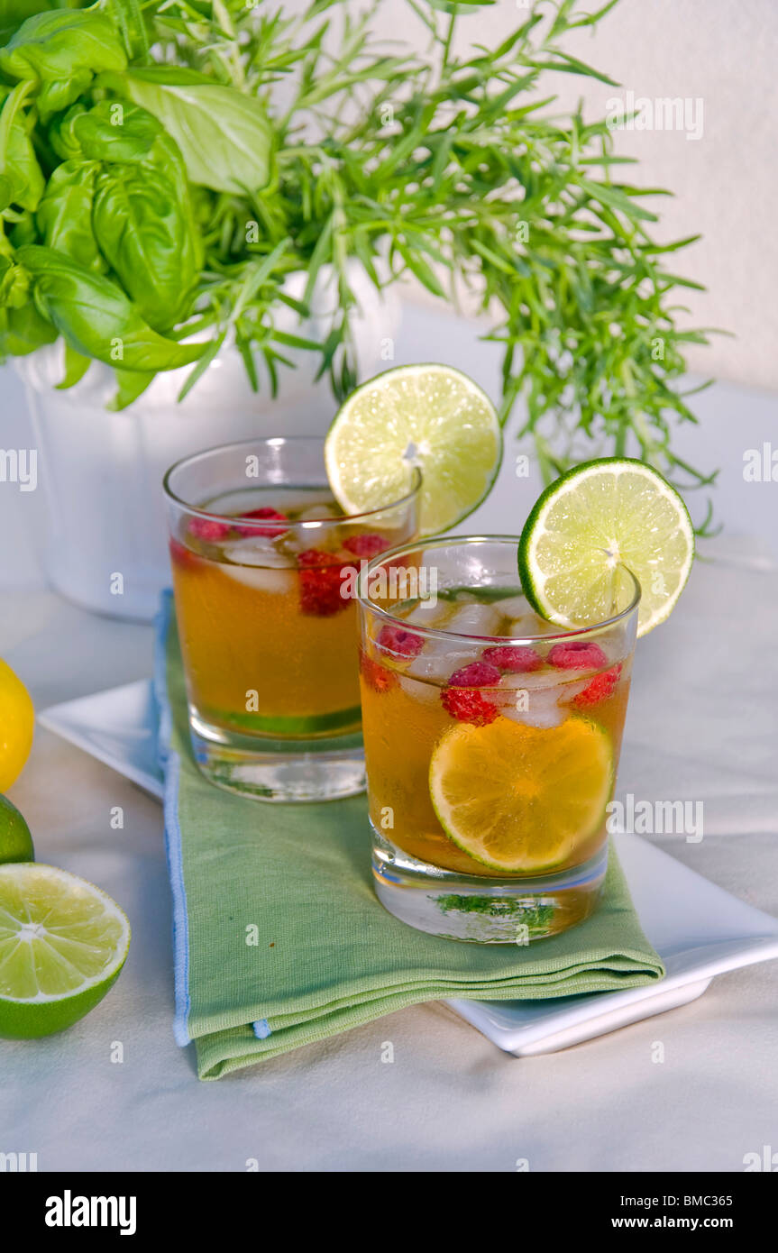 Iced Raspberry Lime Ice tea with raspberry and lime Stock Photo - Alamy