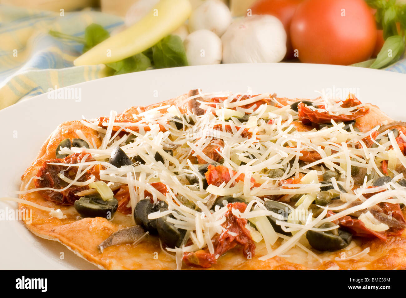 Pizza with olives and parmesan cheese Stock Photo Alamy