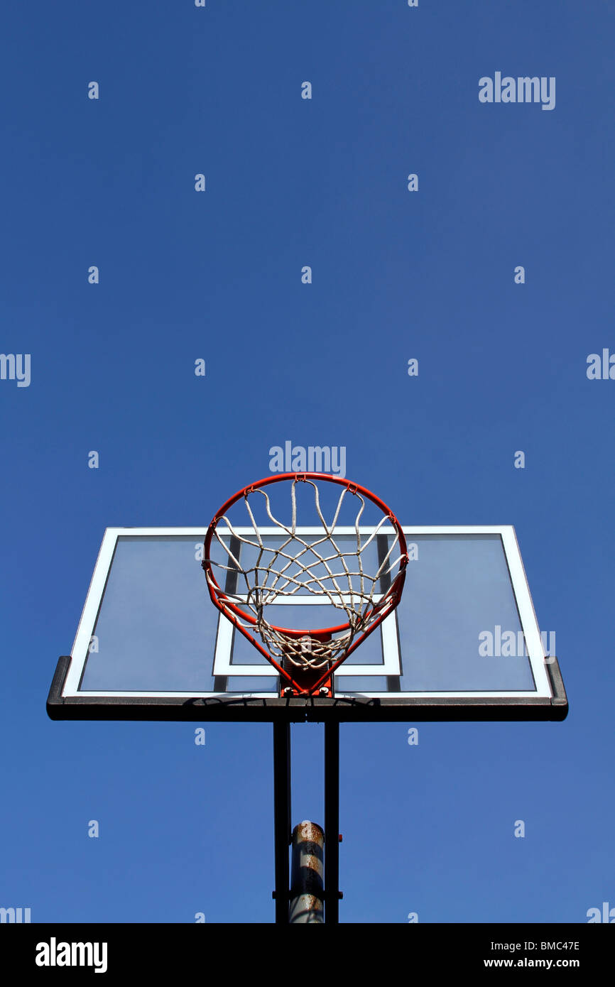 Basketball hoop on a clear blue sky Stock Photo