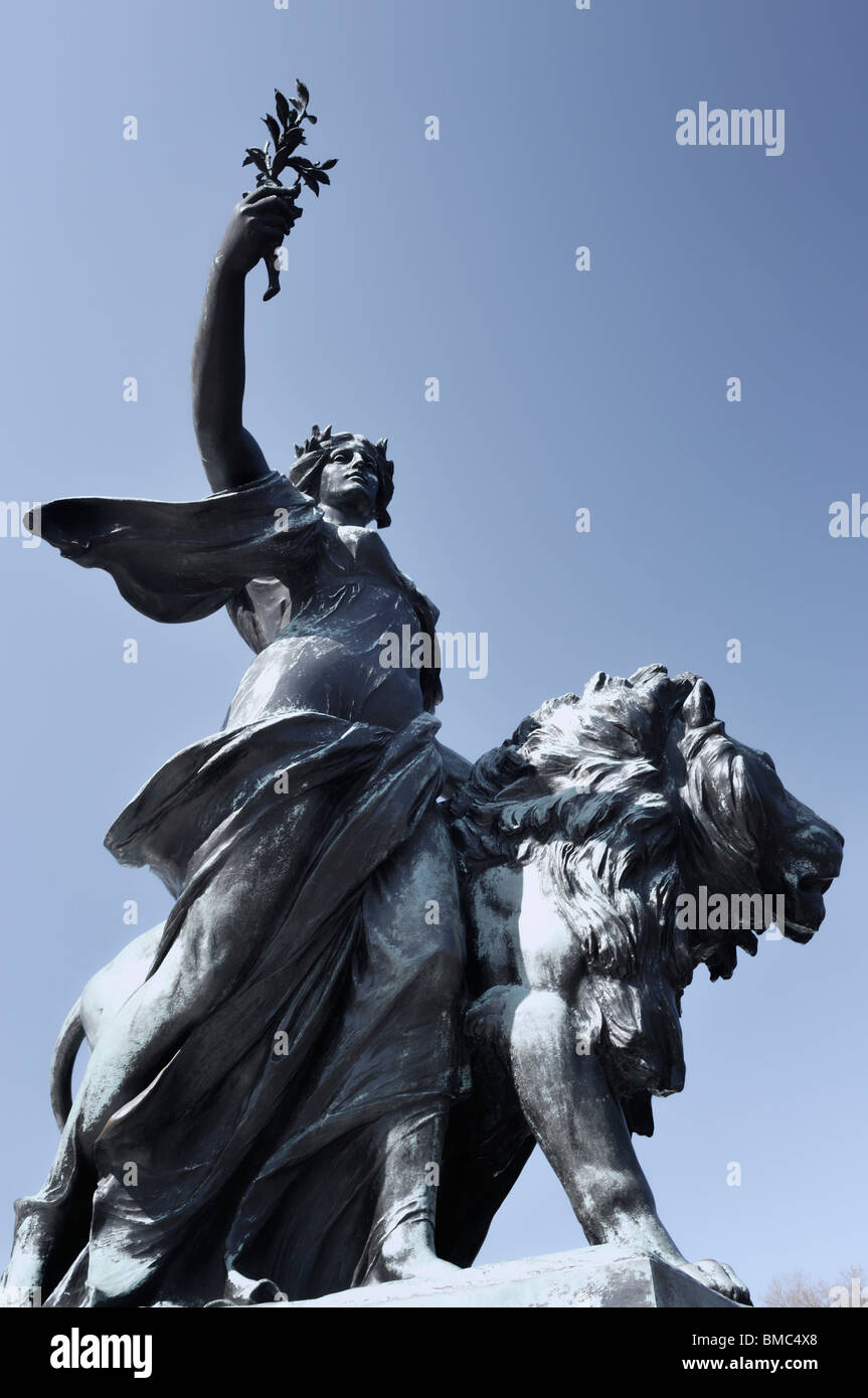 Lion statue on the Victoria Monument outside Buckingham Palace London