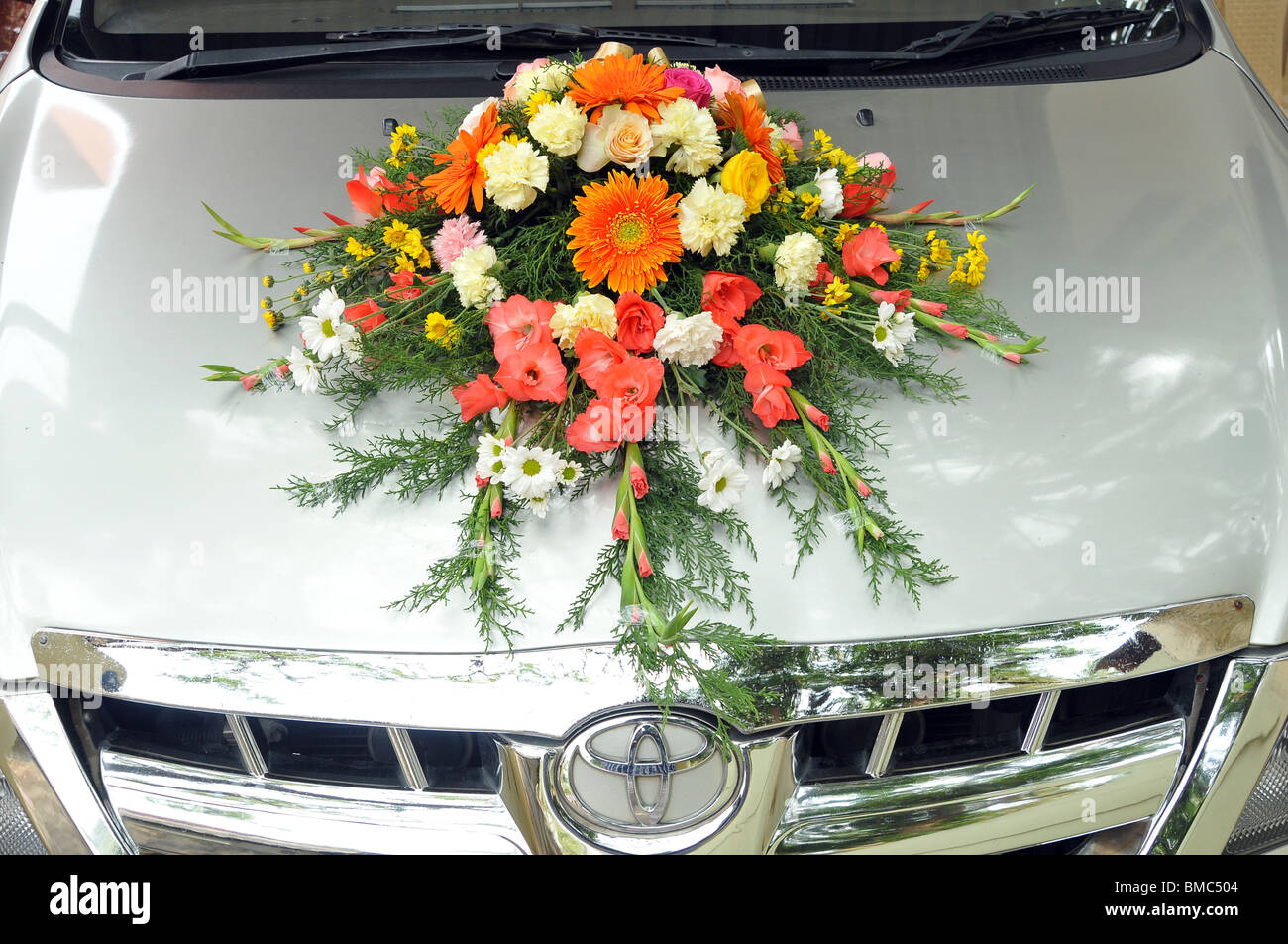 Flower Bouquet As Decoration On Wedding Car High-Res Stock Photo