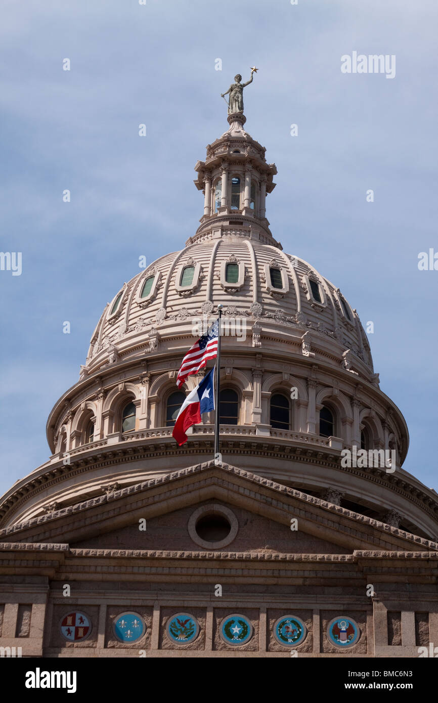Dome of Texas state capitol building or statehouse in Austin with Texas and United States flags Stock Photo