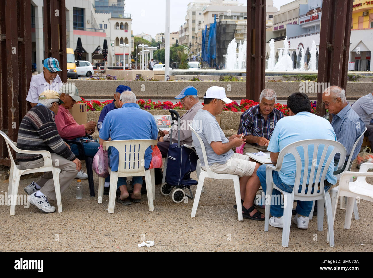 Men playing dominoes and cards on Tel Aviv Promenade Stock Photo