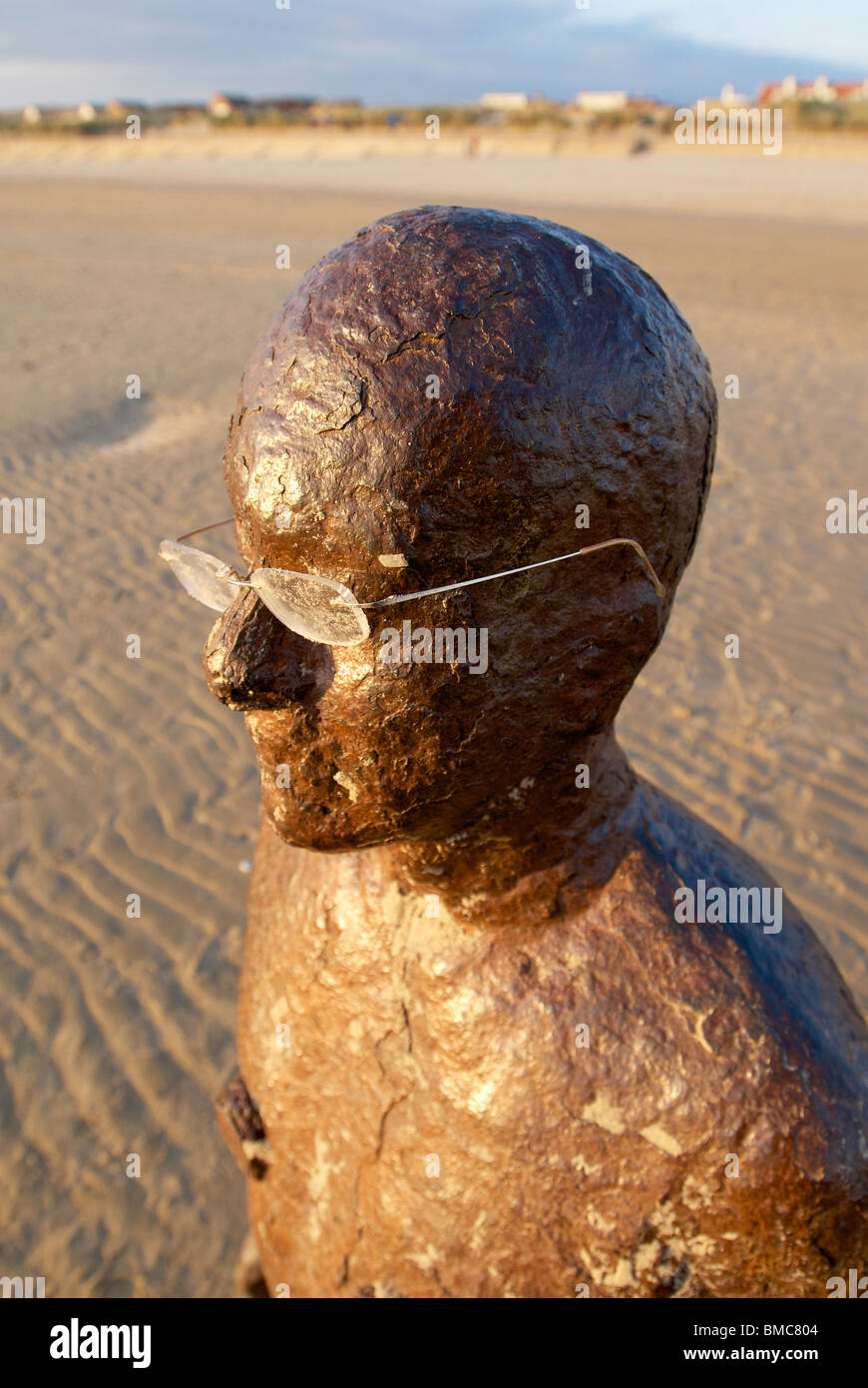 One of the Antony Gormley statues on Crosby beach, Liverpool. The installation is titled ' Another Place. ' Stock Photo