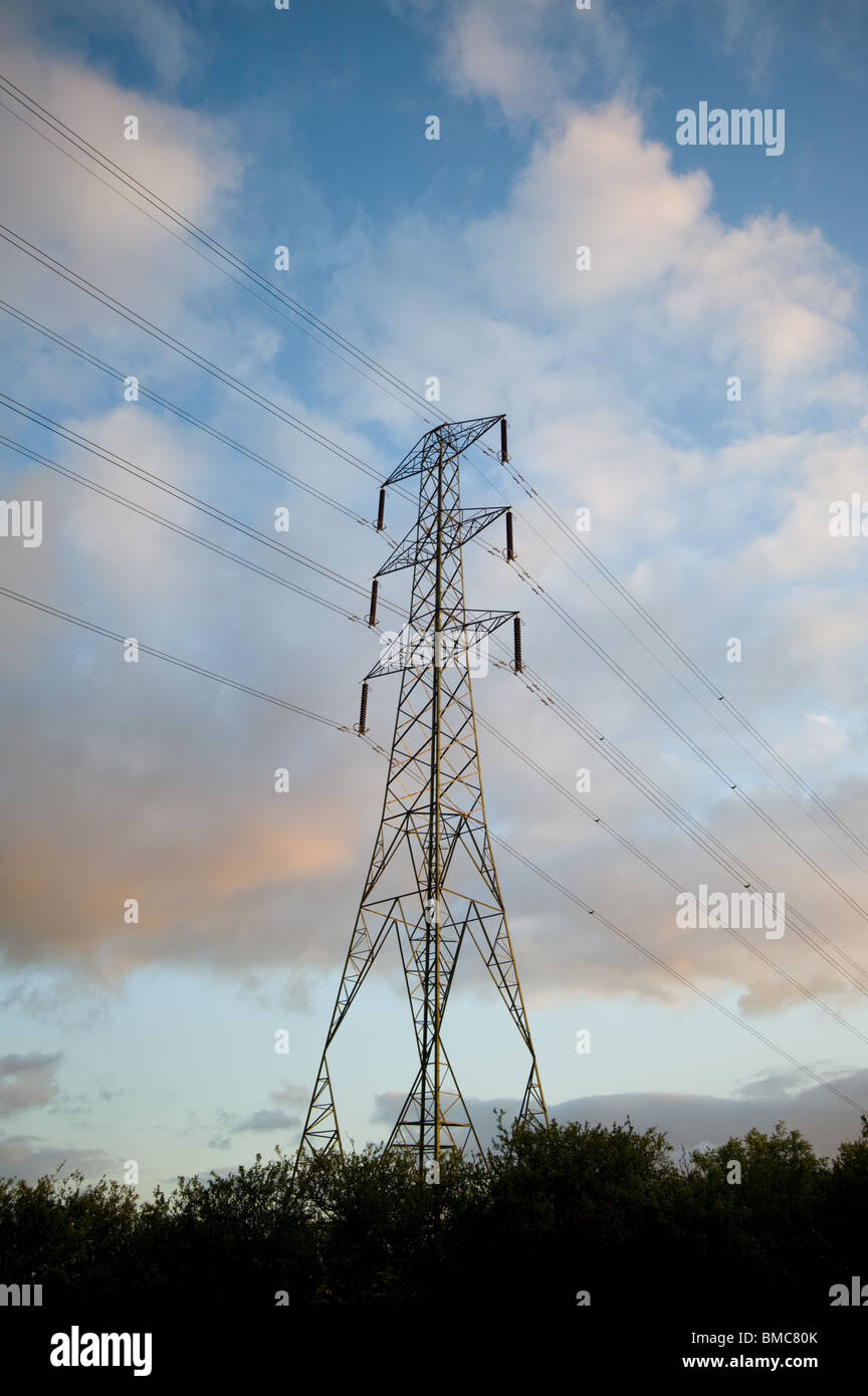 Electricity Pylon against a cloud filled sky Stock Photo - Alamy