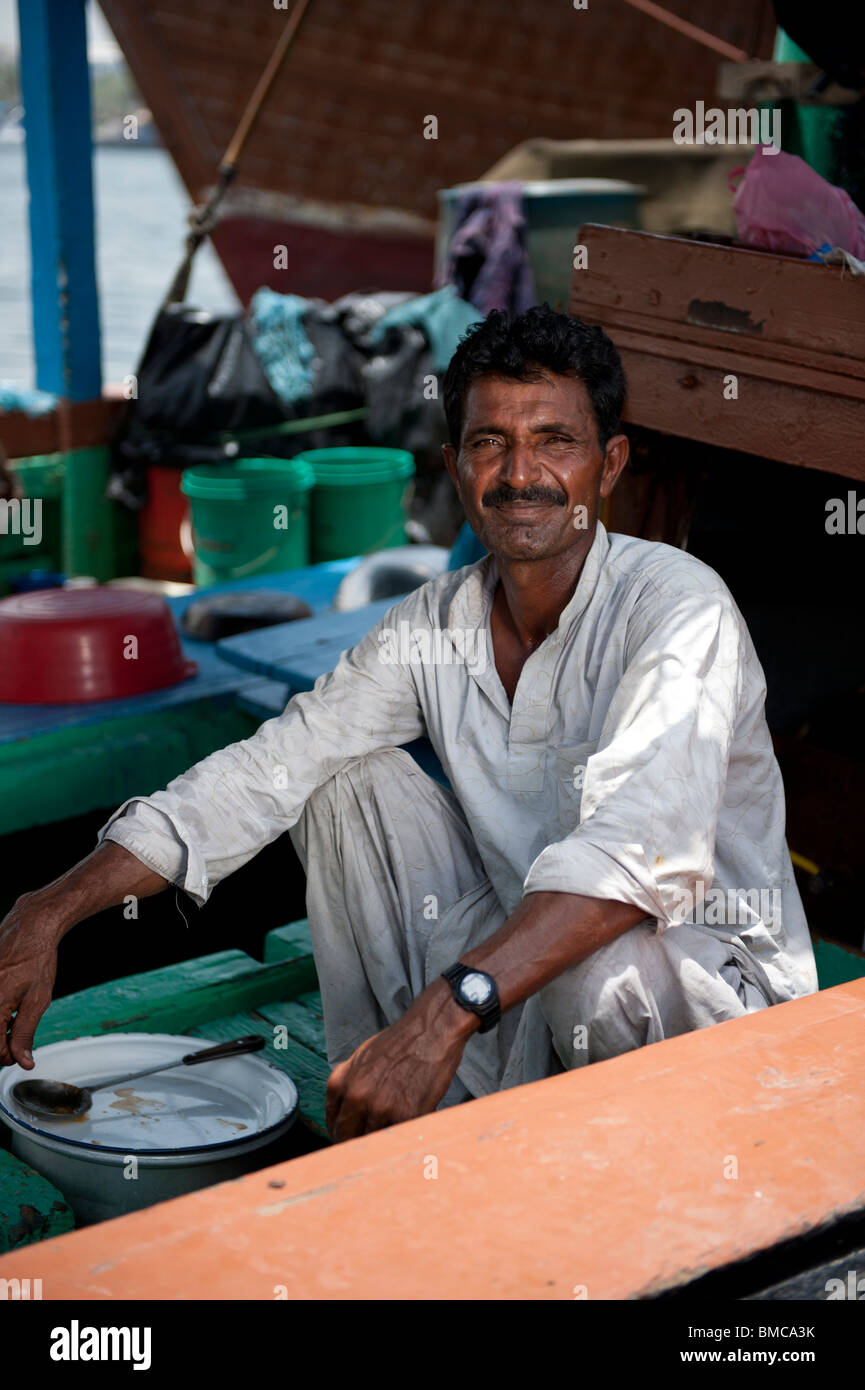 Boat workers at Dubai Creek Stock Photo Alamy