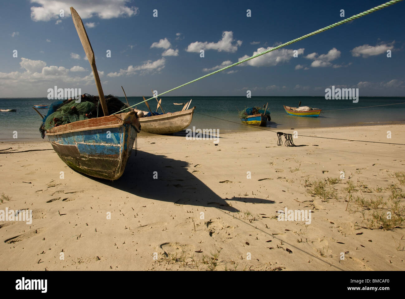 Fishing boats beached for near Lunga, Nampula Province, Mozambique. Stock Photo