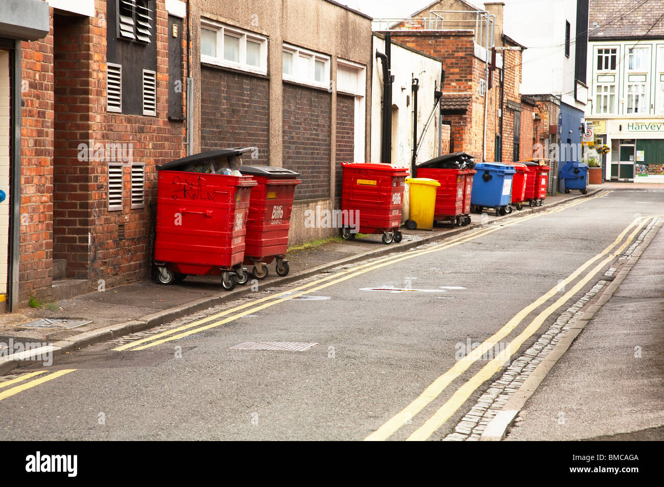 Rubbish containers waiting to be collected Stock Photo Alamy