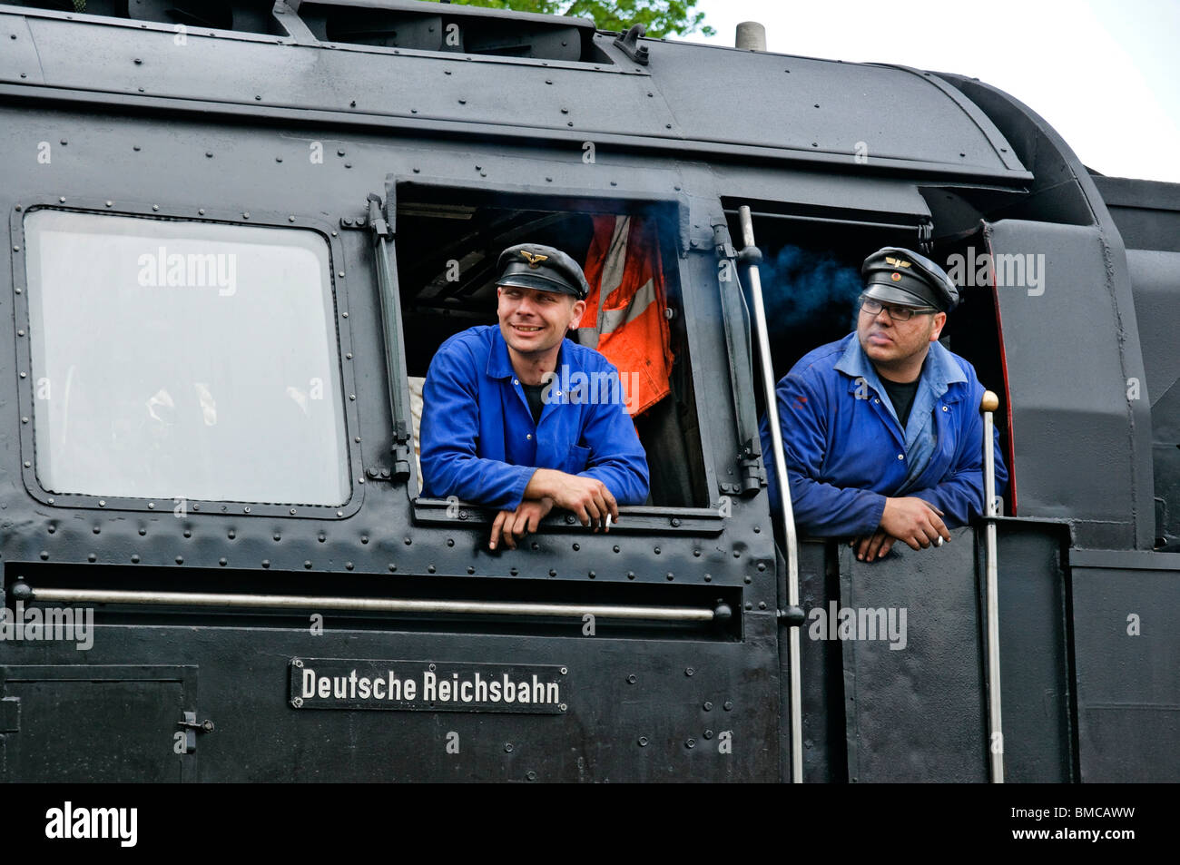 Crew of german class 50 Steam Locomotive waiting to leave Neuenmarkt with a train over the 'Schiefe ebene' incline, Bavaria. Stock Photo