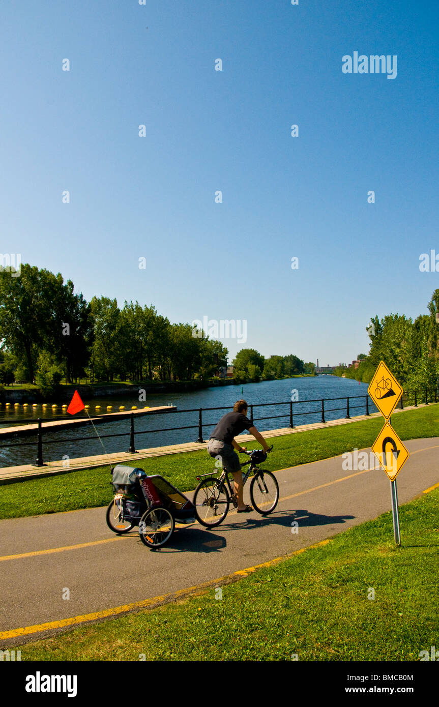 Cycling along Canal Lachine Montreal Stock Photo