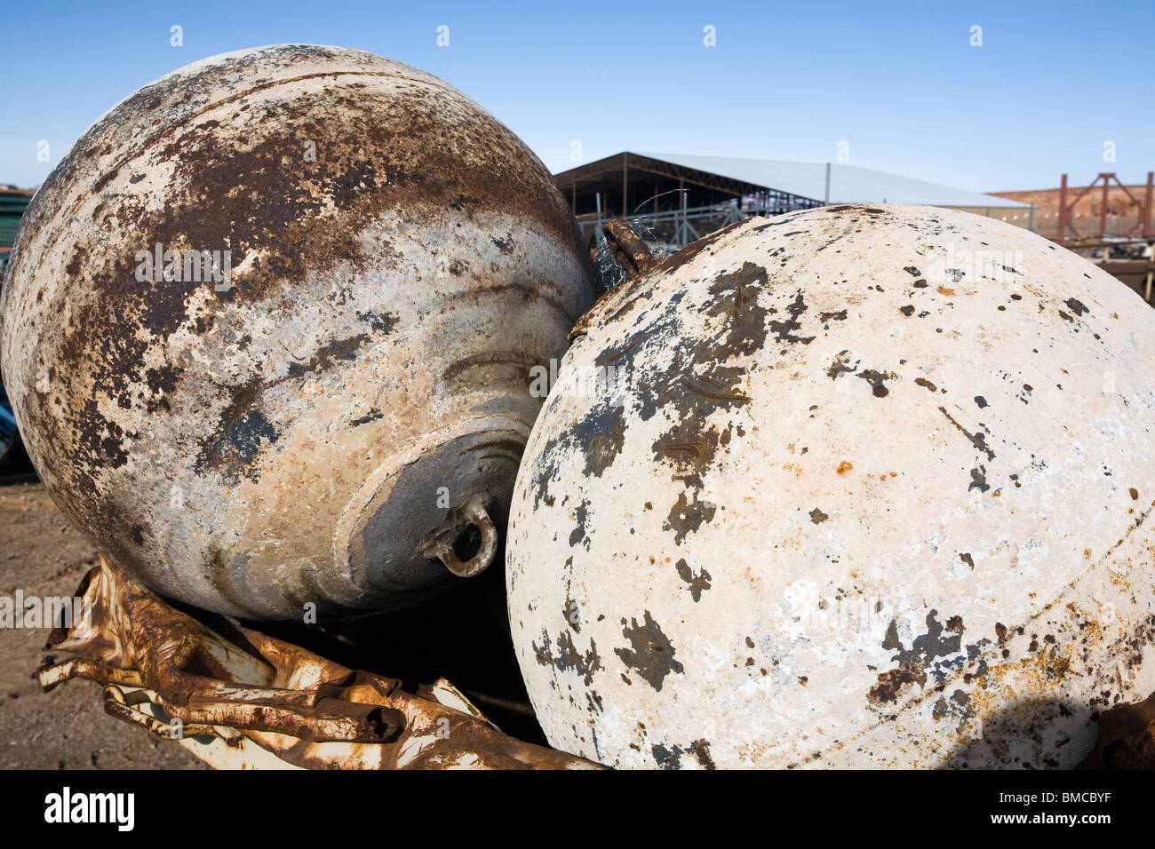 Large iron mooring buoys in scrap yard Stock Photo Alamy