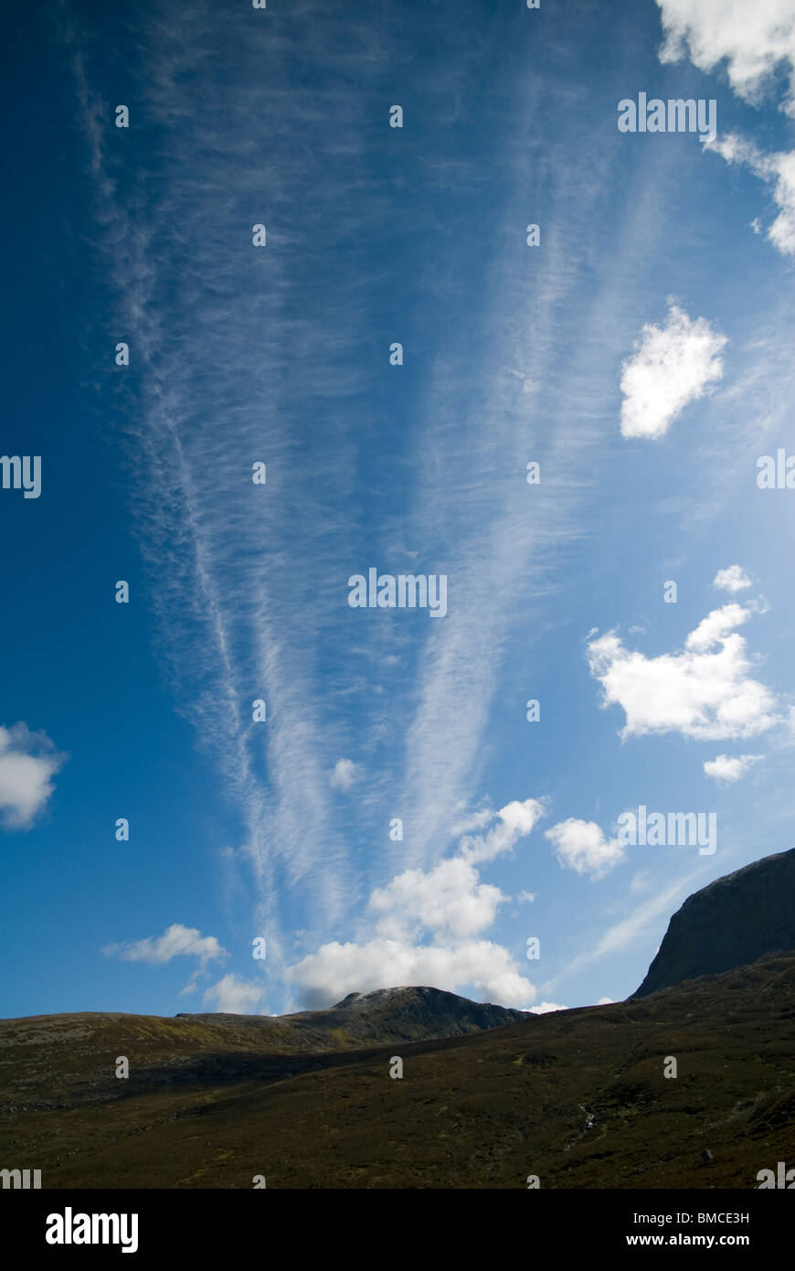 Cirrus clouds over the peak of Eididh nan Clach Geala, Inverlael Forest, east of Ullapool, Highland Region, Scotland, UK Stock Photo