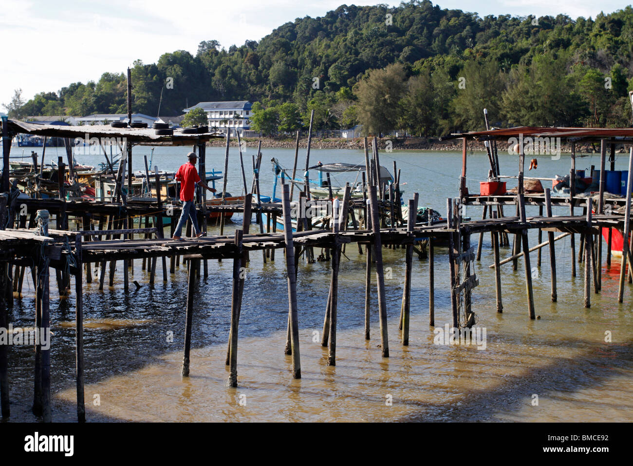 Wooden jetty for fishing boat to moor at a small fishing village in