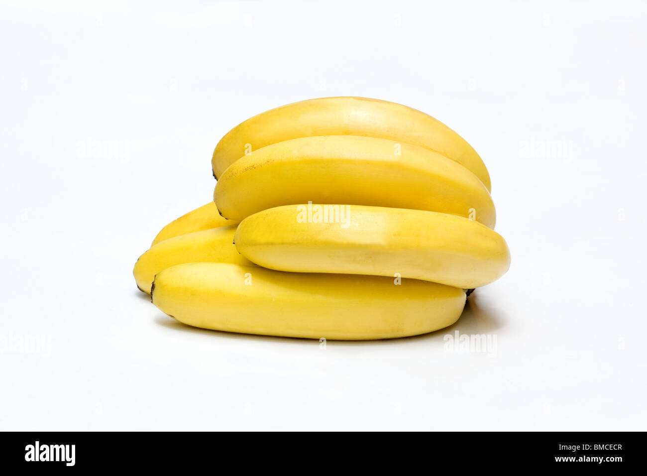 Close-up of a hand of bananas on white background Stock Photo