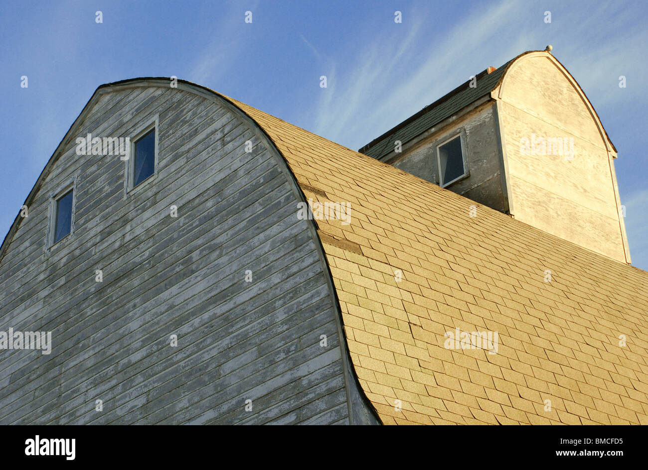 An old barn roof against a deep blue sky Stock Photo - Alamy