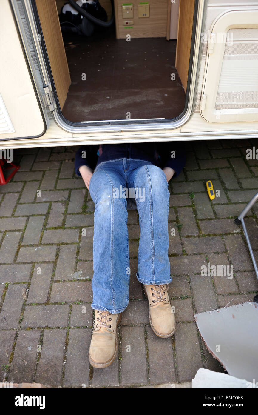 Repairing underneath Caravan Floor Stock Photo Alamy