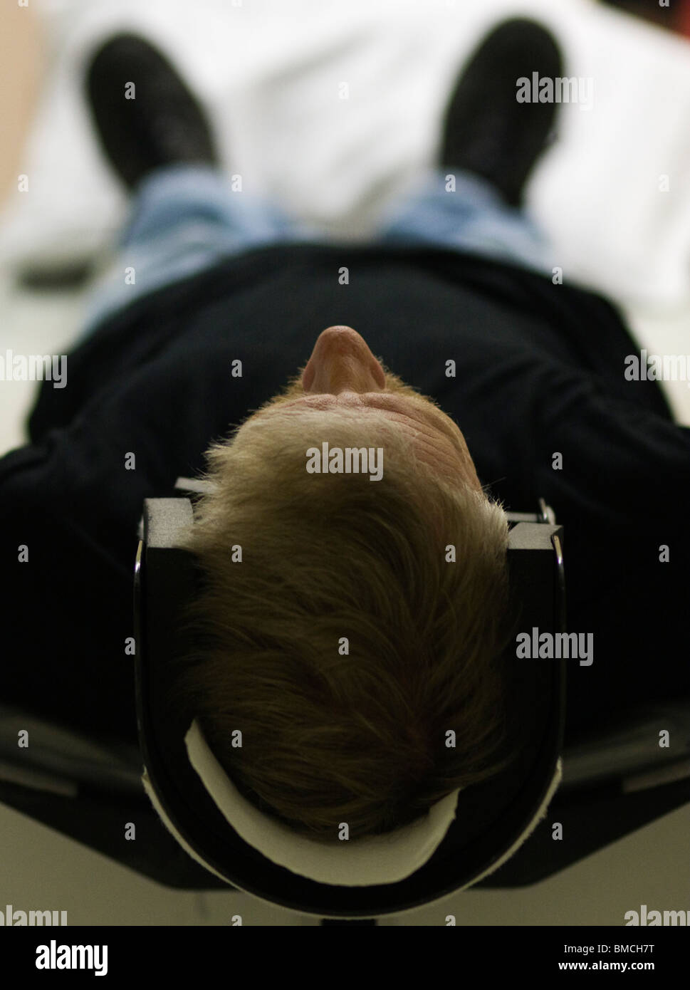 Man set in the right position before doing a CT (Computer Tomography) scan of the head. Stock Photo