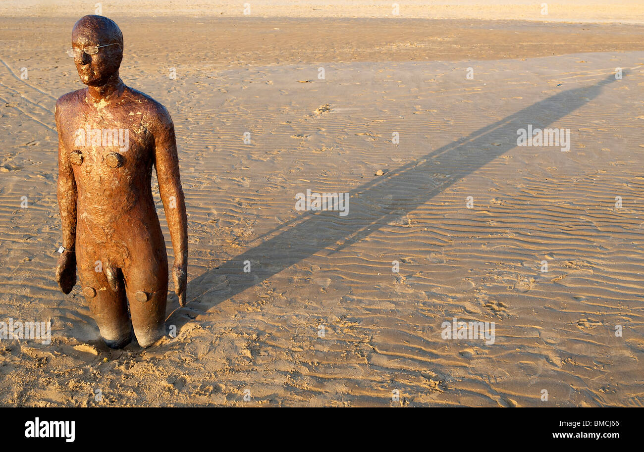 One of the Antony Gormley statues on Crosby beach, Liverpool. The