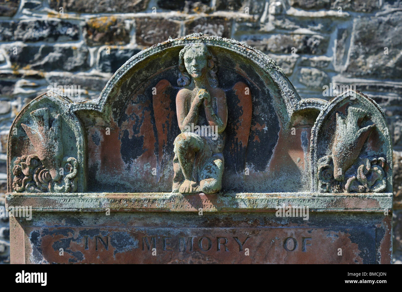 Detail of 19th.Century gravestone with angel and doves. Church of Saint Mary, Thornthwaite, Lake District National Park, Cumbria Stock Photo