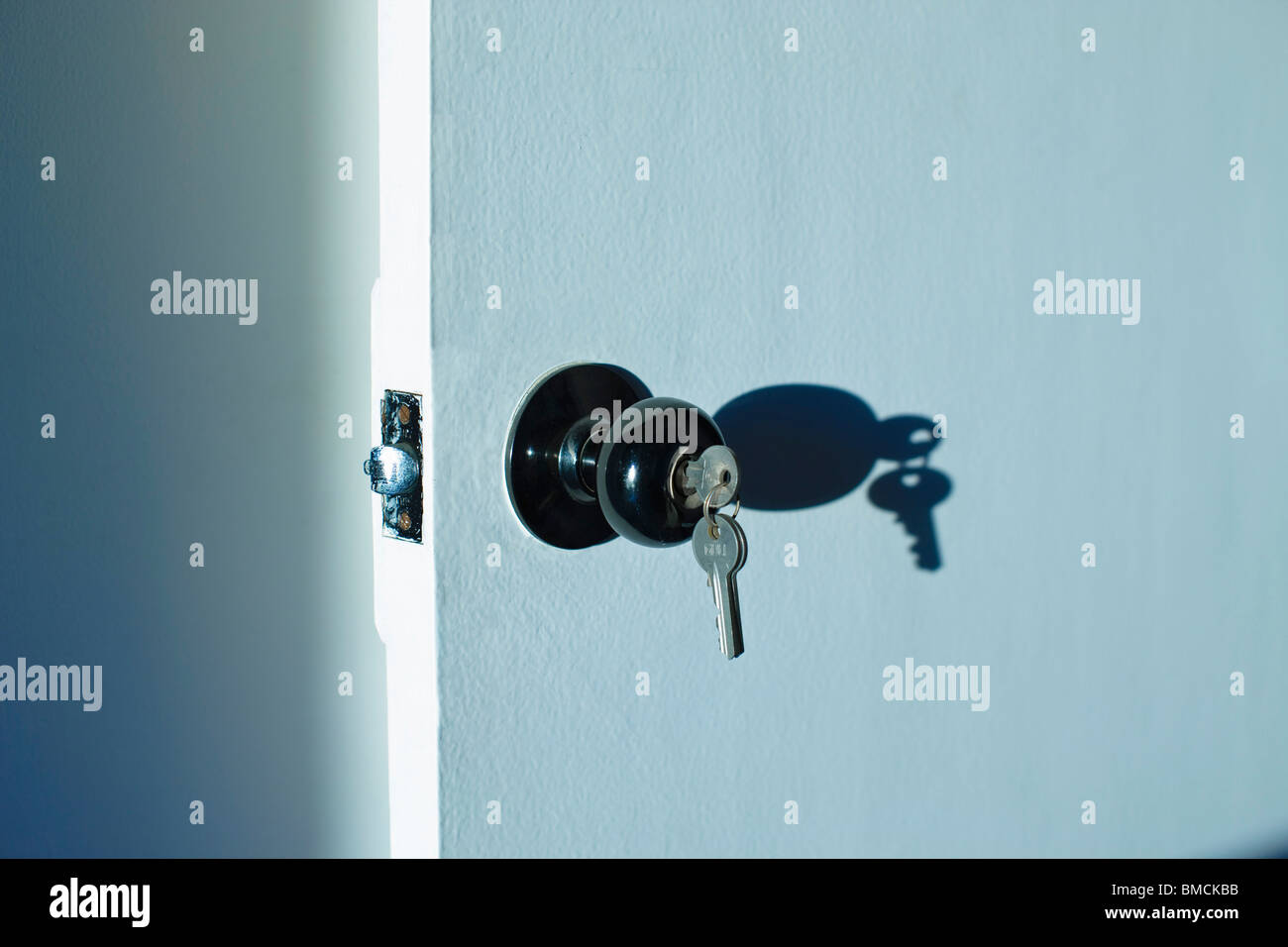 Keys in Door Lock Stock Photo Alamy
