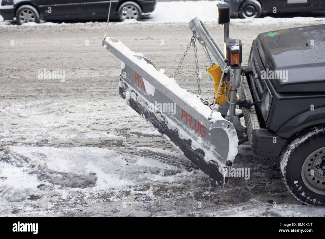 Snow plough ploughing the street hires stock photography and images