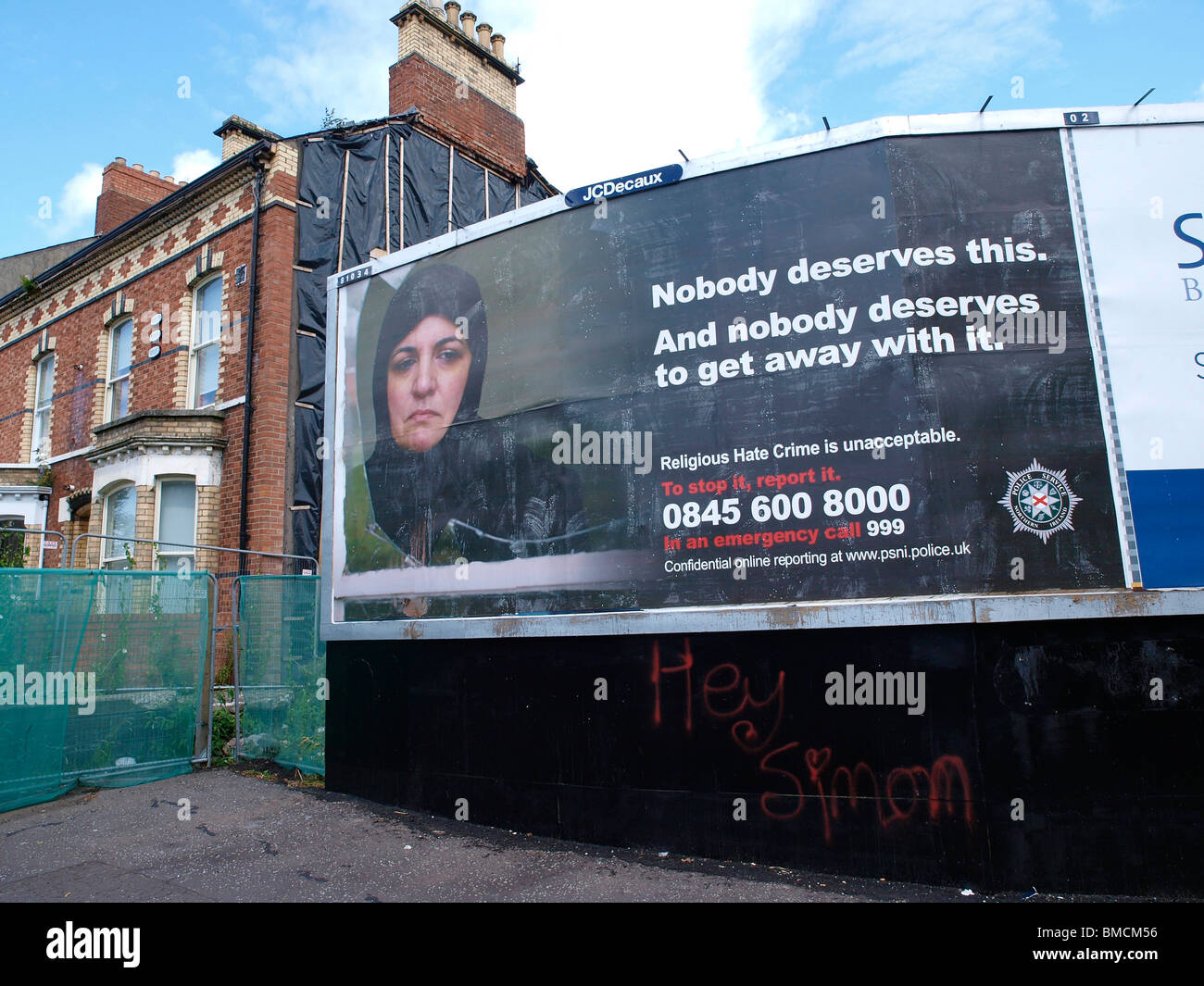 Billboard poster put up by the Police Service of Northern Ireland ( PSNI) publicising their Religious Hate Crime number. Stock Photo