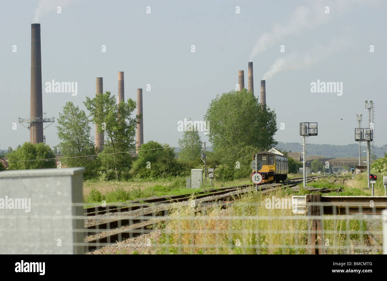 The Bedford to Bletchley line with the Stewartby brick works in the background, Bedfordshire, England, UK Stock Photo