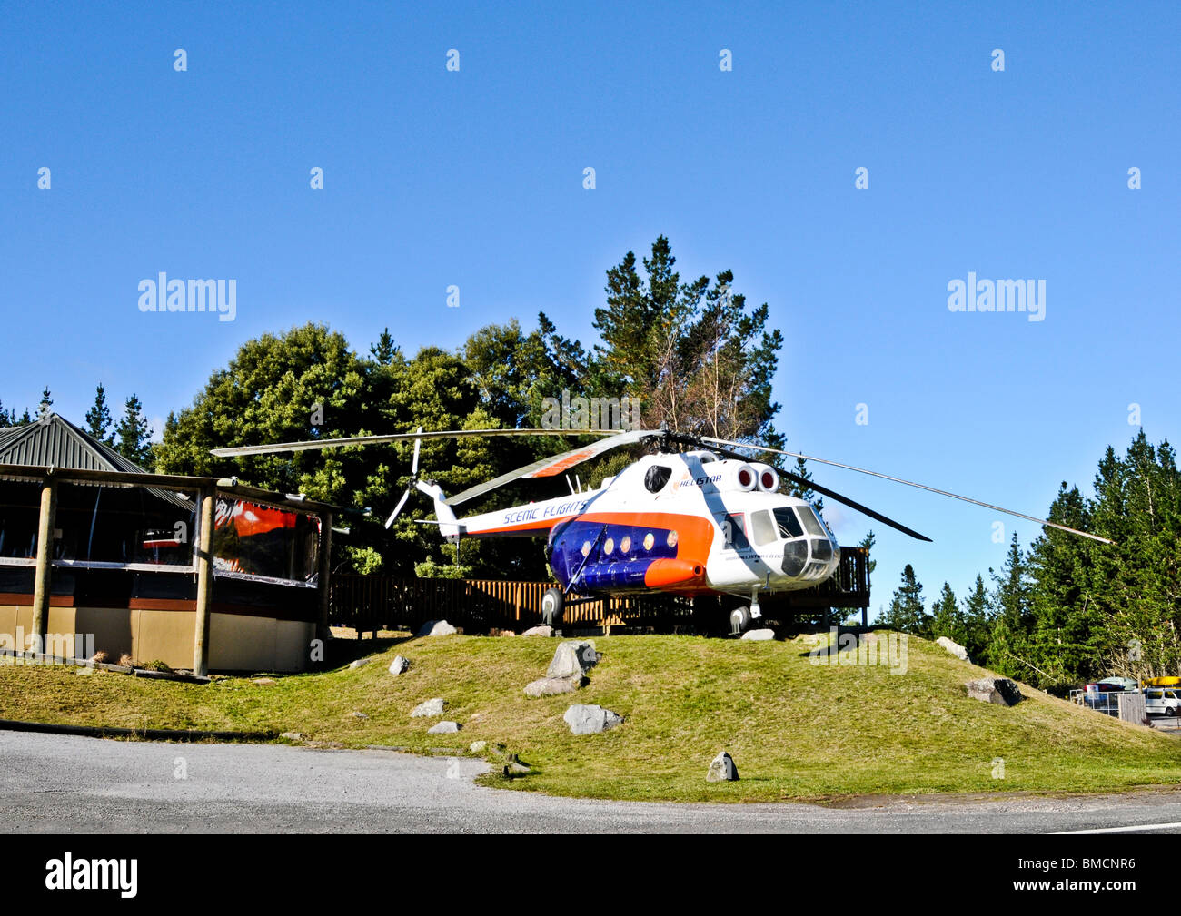 Helicopter parked on heliport to fly tourists to view wonderful landscapes of Huka Falls, Waikato River, and Lake Taupo NZ. Stock Photo