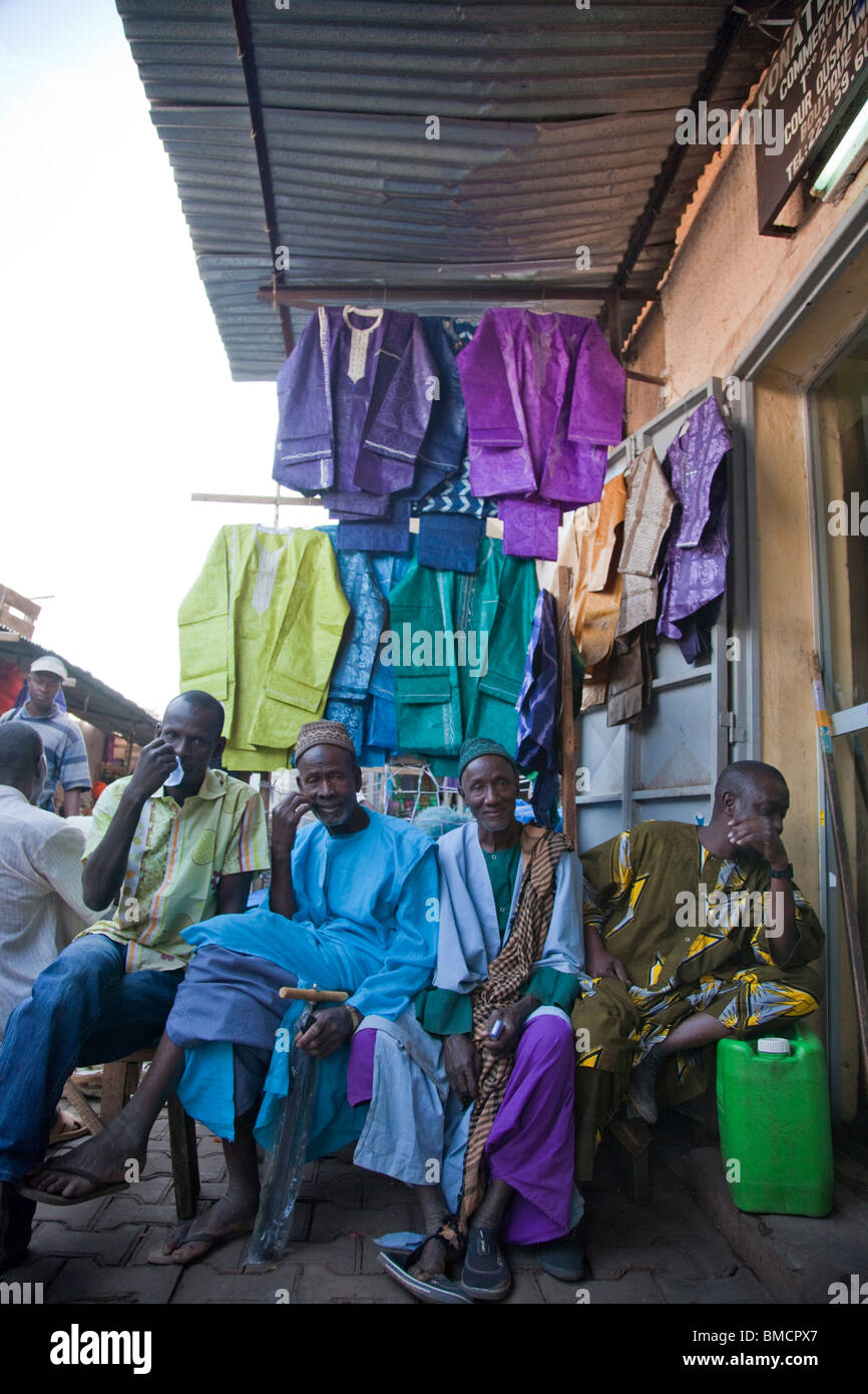 A shop in the Grand Marche of Bamako, Mali sells colorful pieces of clothing. Stock Photo