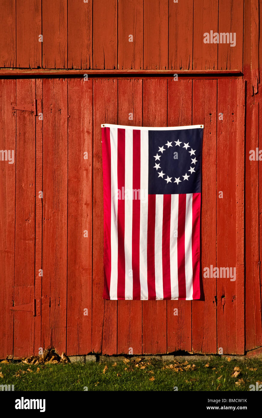 Close up replica of a vintage American flag, 13 stars and srripes, Betsy Ross on old red barn, New Jersey, United States flag, US flag close up Stock Photo