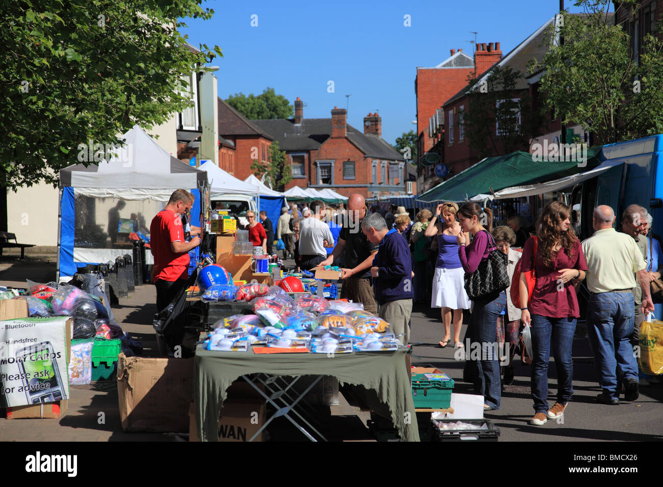 People shopping at the Wednesday street market in Market Drayton, Shropshire Stock Photo Alamy