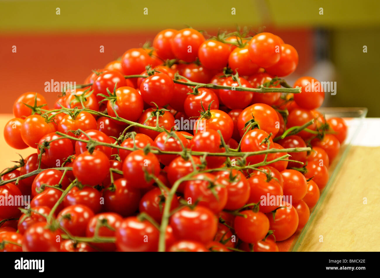 Stock photo of a bunch of cherry tomatoes for sale on a market stall ...