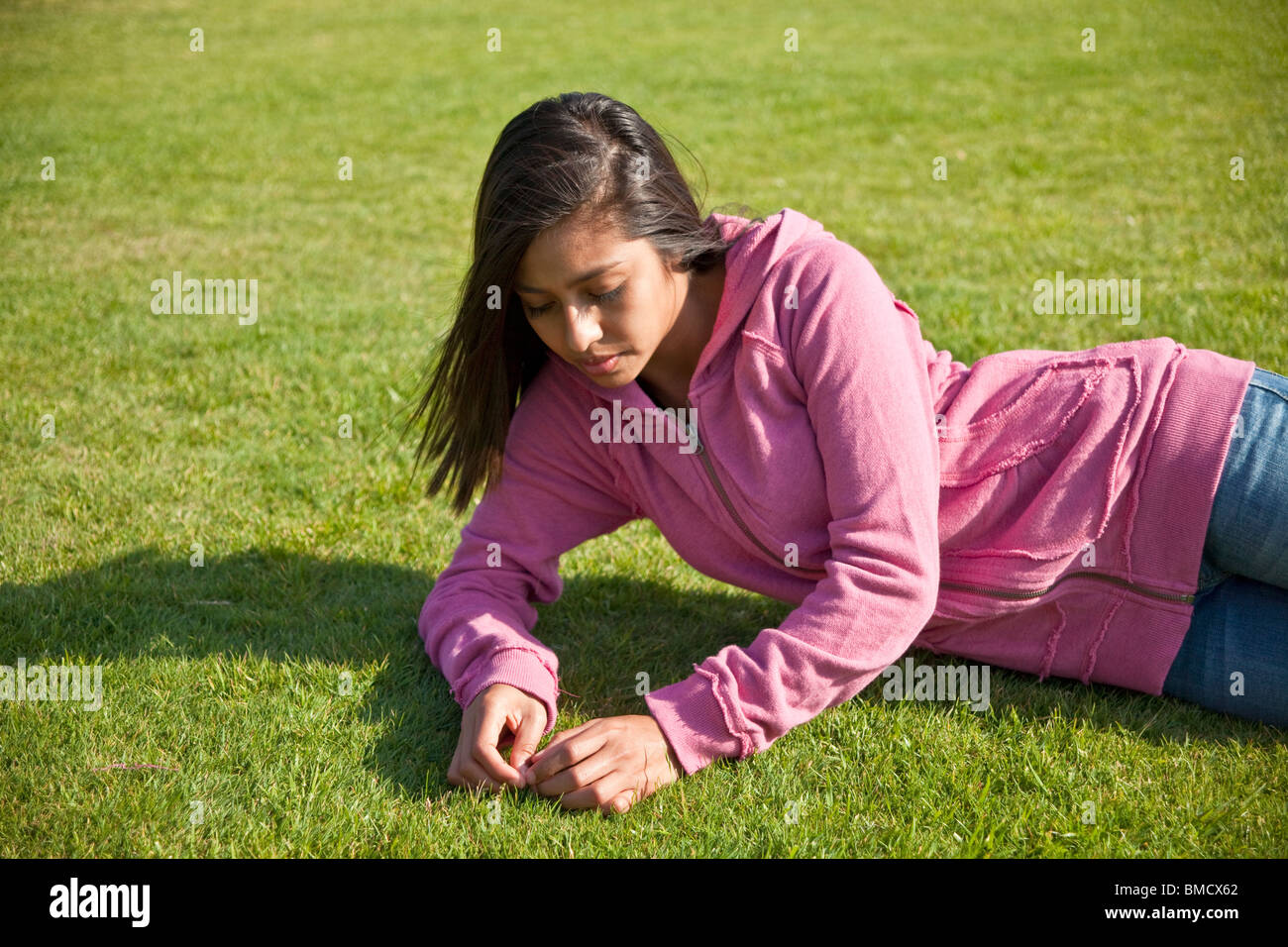 Relaxing relaxed Teen 15-17 year old meditating reflects ponders pondering serious thoughts multicultural diversity thoughtful dreaming side view  © Myrleen Pearson Stock Photo