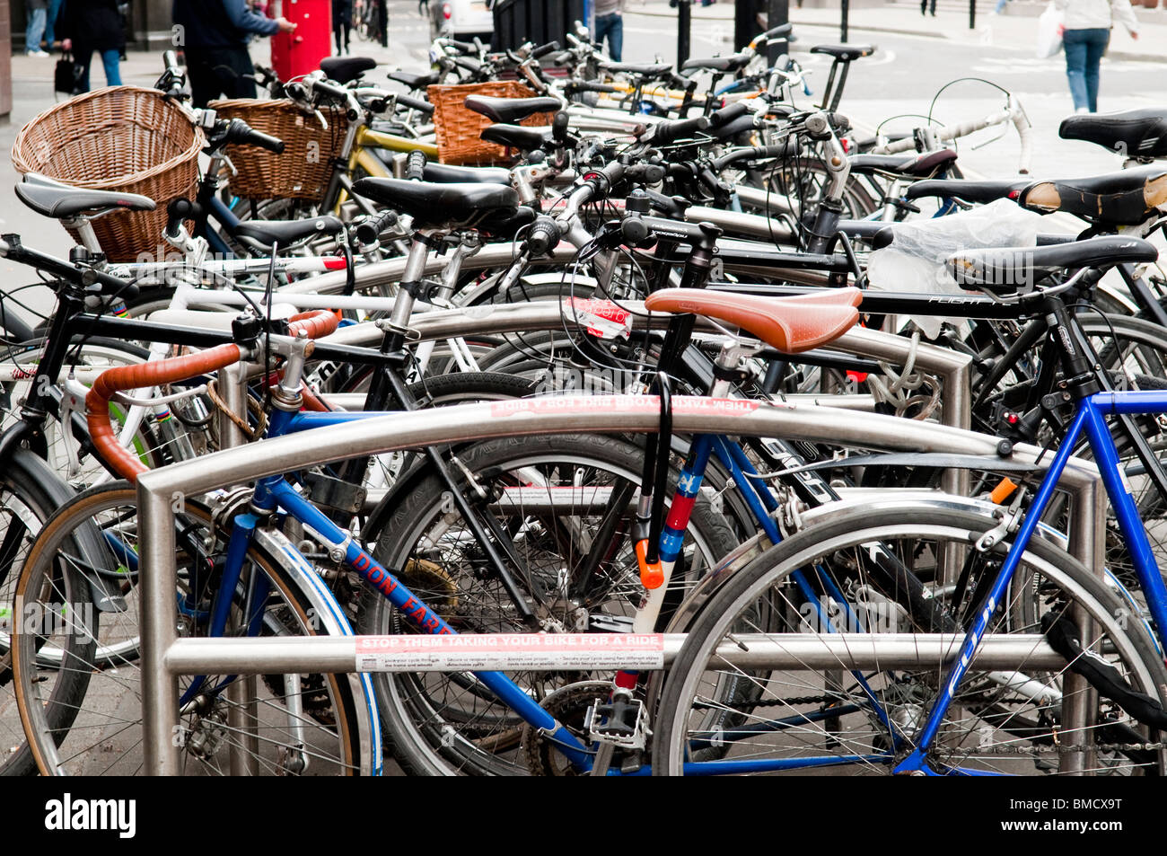 bikes parked in bike rack Stock Photo Alamy