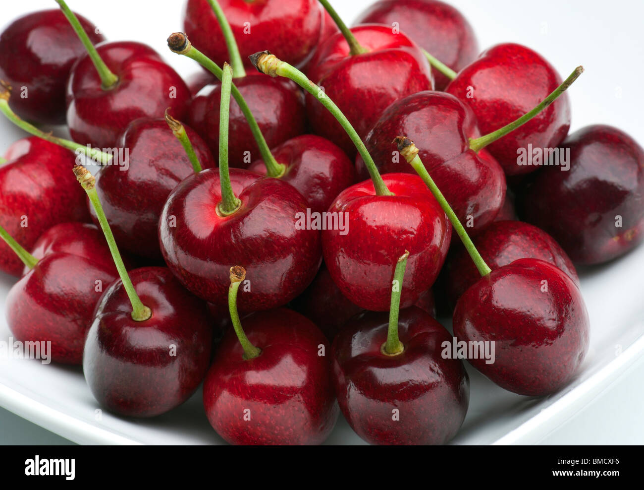 Fresh Cherries In A White Dish Stock Photo
